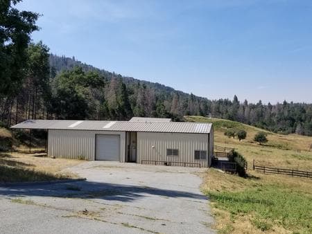 Exterior view of the metal workshop and attached caretaker's apartment. 