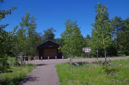 Entrance to POTATO PATCH CAMPGROUND with restrooms and entrance signs