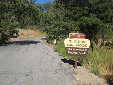 Roadway leading up to North Shore Campground Sign