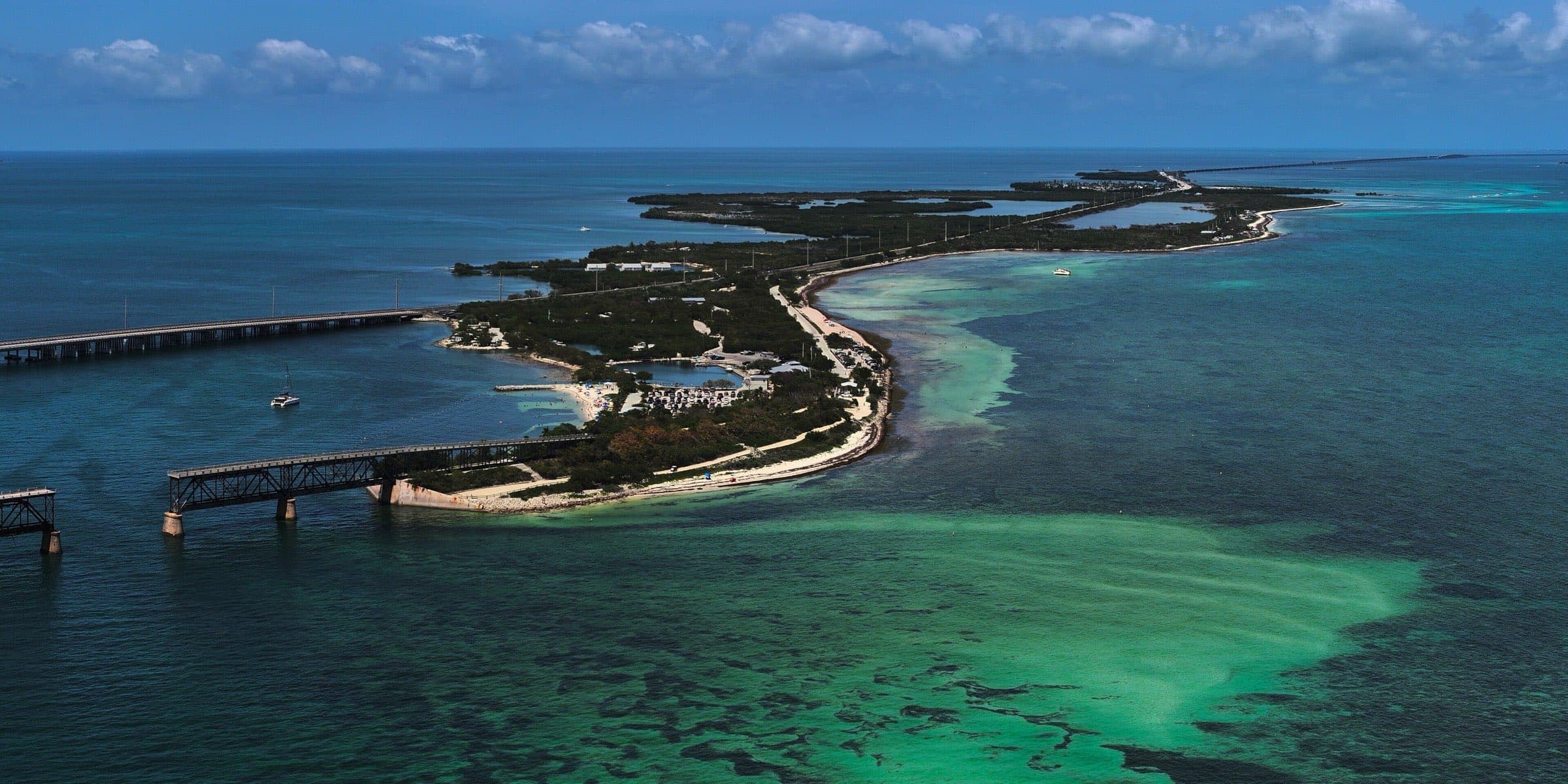 Aerial view of Bahia Honda Key in the Florida Keys, with the old Bahia Honda Bridge, beaches and the state park campground