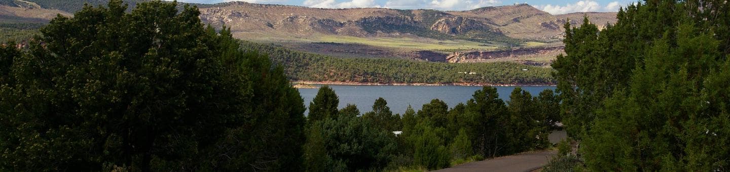 This camp site is near the lake. On the other side of the lake are hills, meadows and deep ravines.