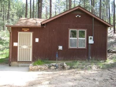 HORSETHIEF CABIN exterior, one step up from the parking area to screen door on left side of the cabin.