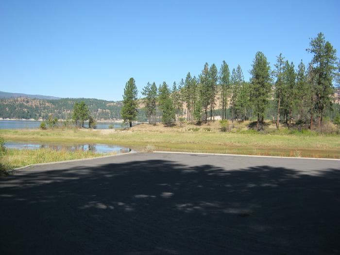 Looking towards the campground from the boat launch. Trees in the distance.