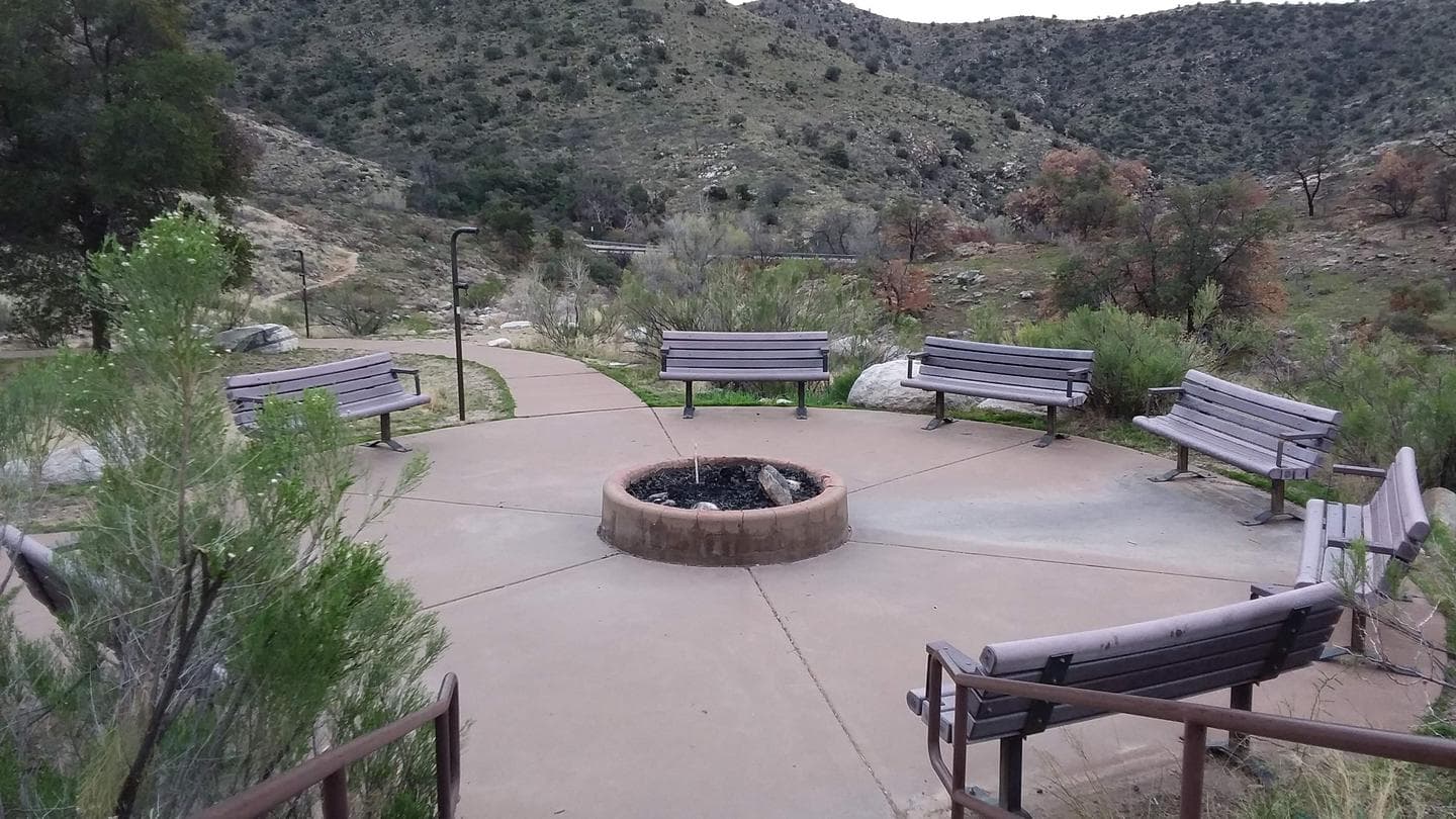 Group area with multiple benches and a firepit.