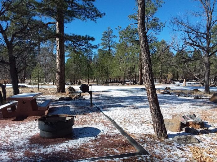 Rock Crossing Campground Site 07: shows table, fire pit, standing grill, and easy road access