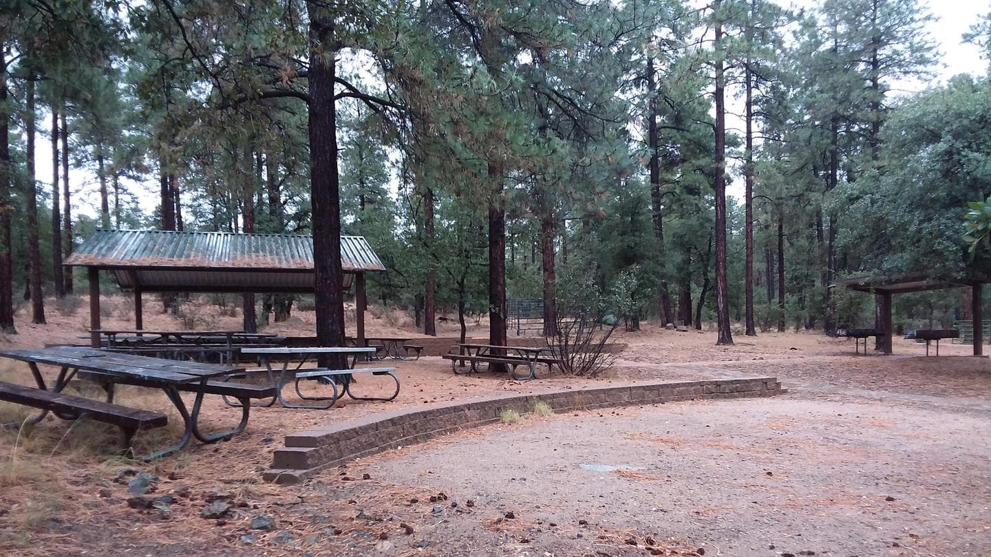 GROOM CREEK HORSE CAMP group shelter with 5 large table and 2 barbecues is the rear on the left side