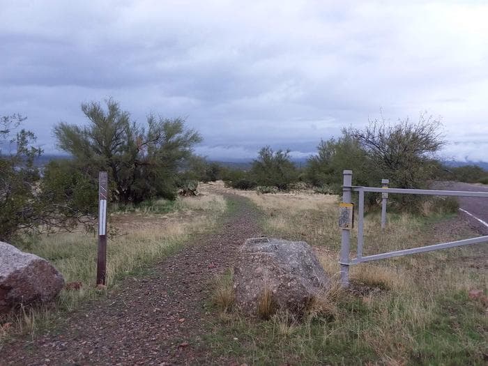 Grapevine trailhead between two large rocks