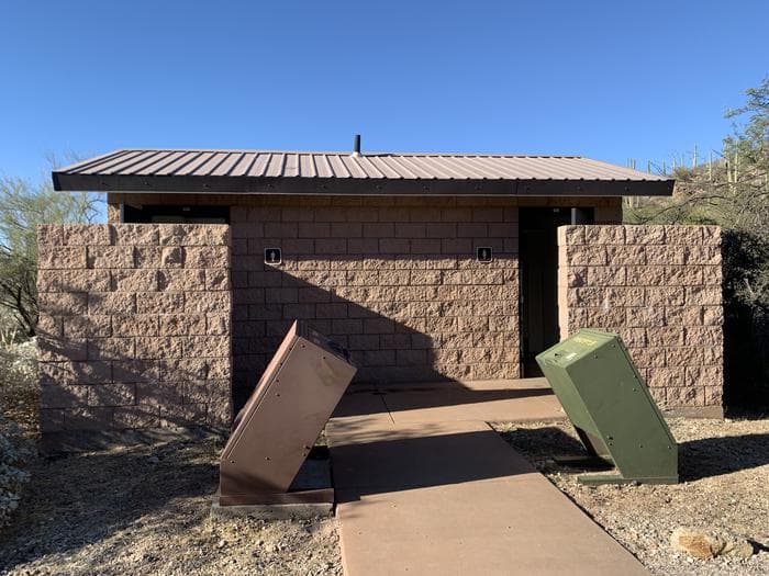 Stone building pit toilet