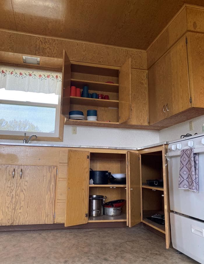 Some basic amenities are stored in the cabinets of both Orange Olsen Dwelling and Cabin.