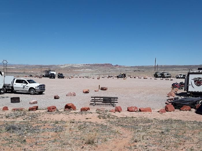 Courthouse Rock Campground campsites with Arches National Park in the distance