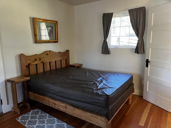 Double bed with nightstands on either side.