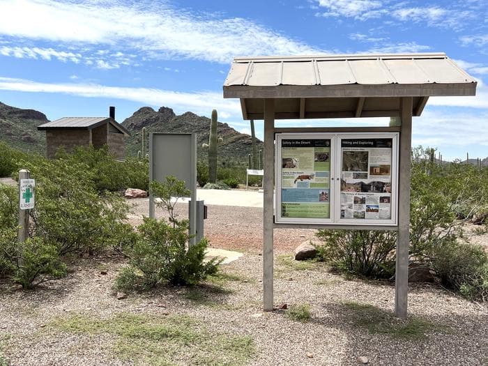 Two information boards near the restroom.