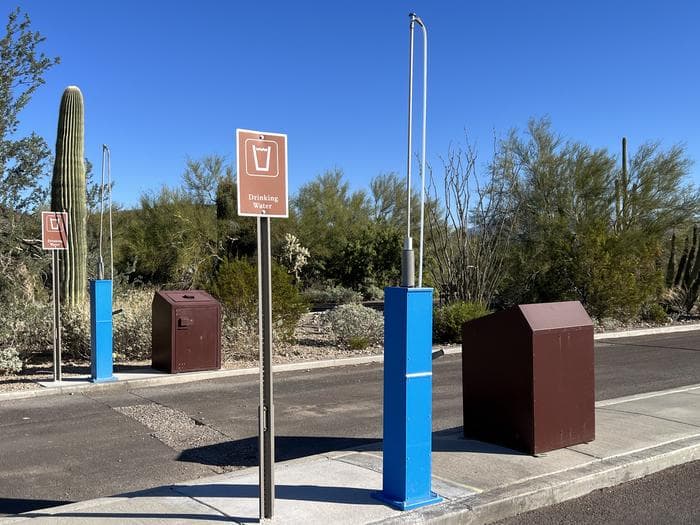 Twin Peaks dump station, with trash receptacles and potable/non-potable hoses.