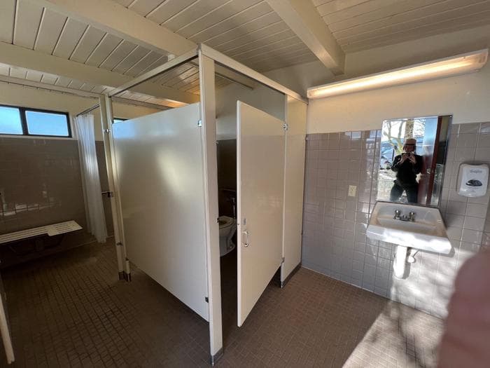 The interior of the campground bathrooms, featuring an ADA stall and shower.