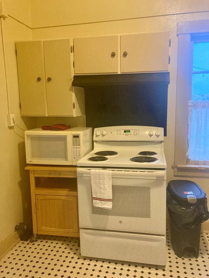 Kitchen with stove and microwave